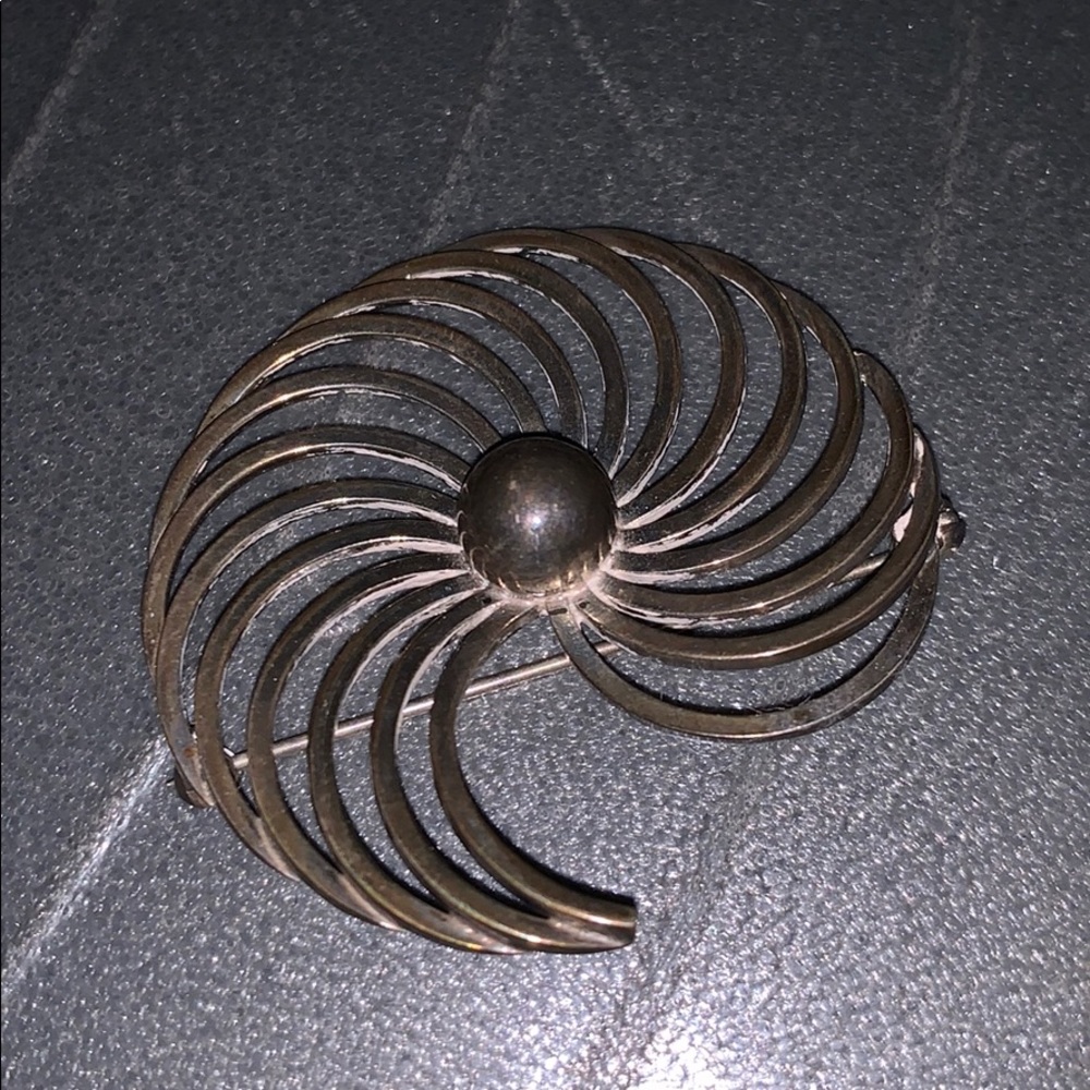 Swirling Art Deco sterling brooch.